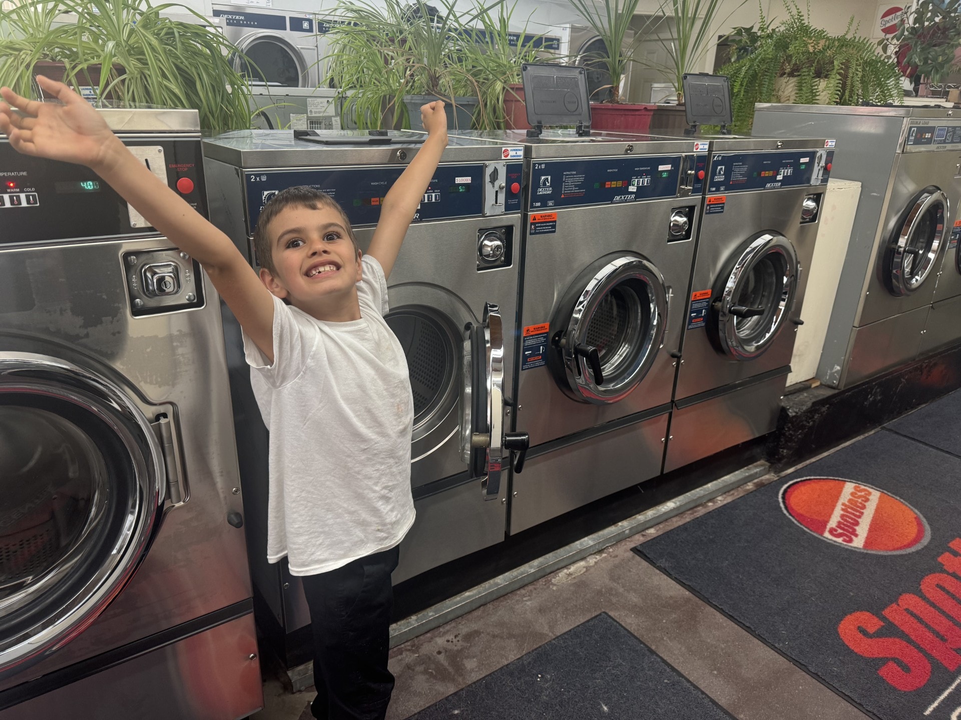 Happy customer at Spotless Cleaning Centre laundromat